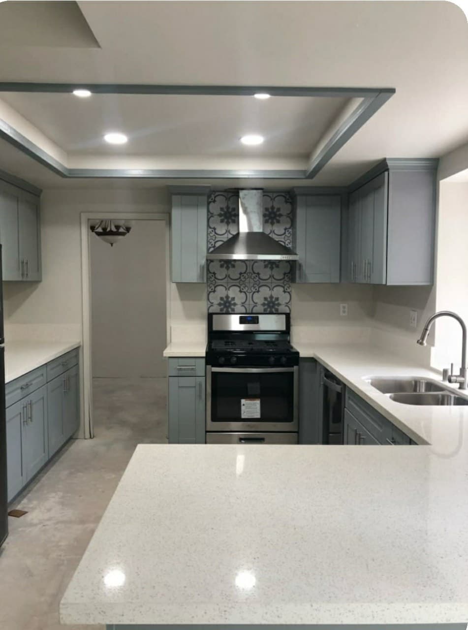 picture of a newly remodeled kitchen with granite countertops and cabinets with luxury ficxtures