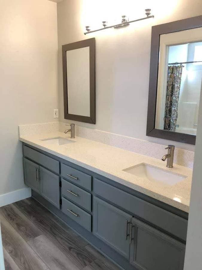 picture of a newly remodeled bathroom with new fixtures and luxury countertops